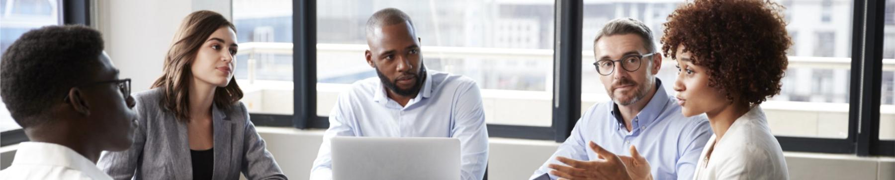 Millennial black businesswoman addressing colleagues at a corporate business meeting, close up Member Networks Banner